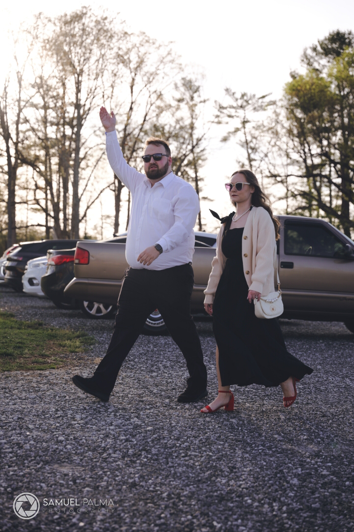 An image of a teacher waving at students at Prom 2025